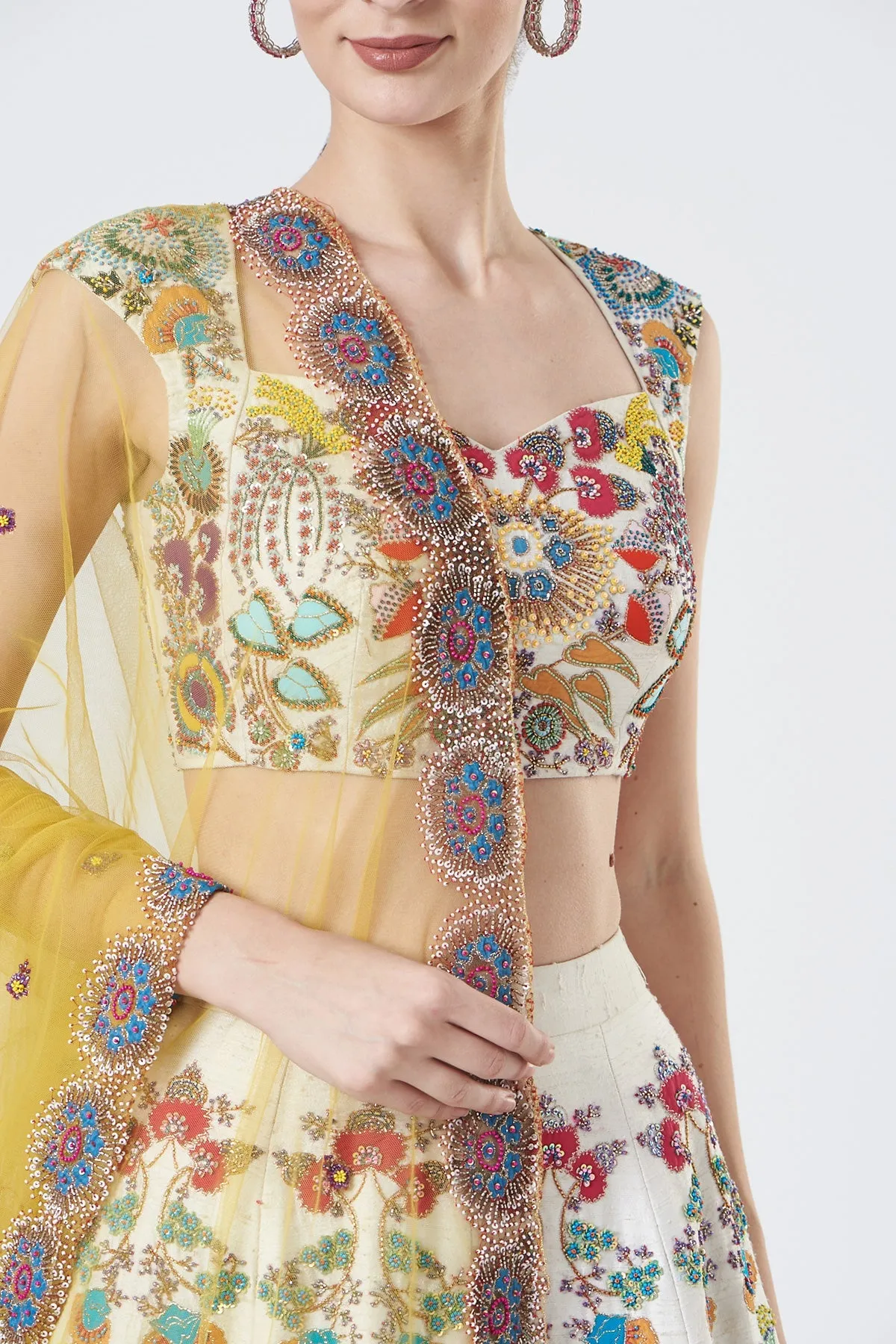 Ivory Paper Dolls Raw Silk Appliquéd And Embellished Lehenga With Blouse And Cutwork Tulle Dupatta