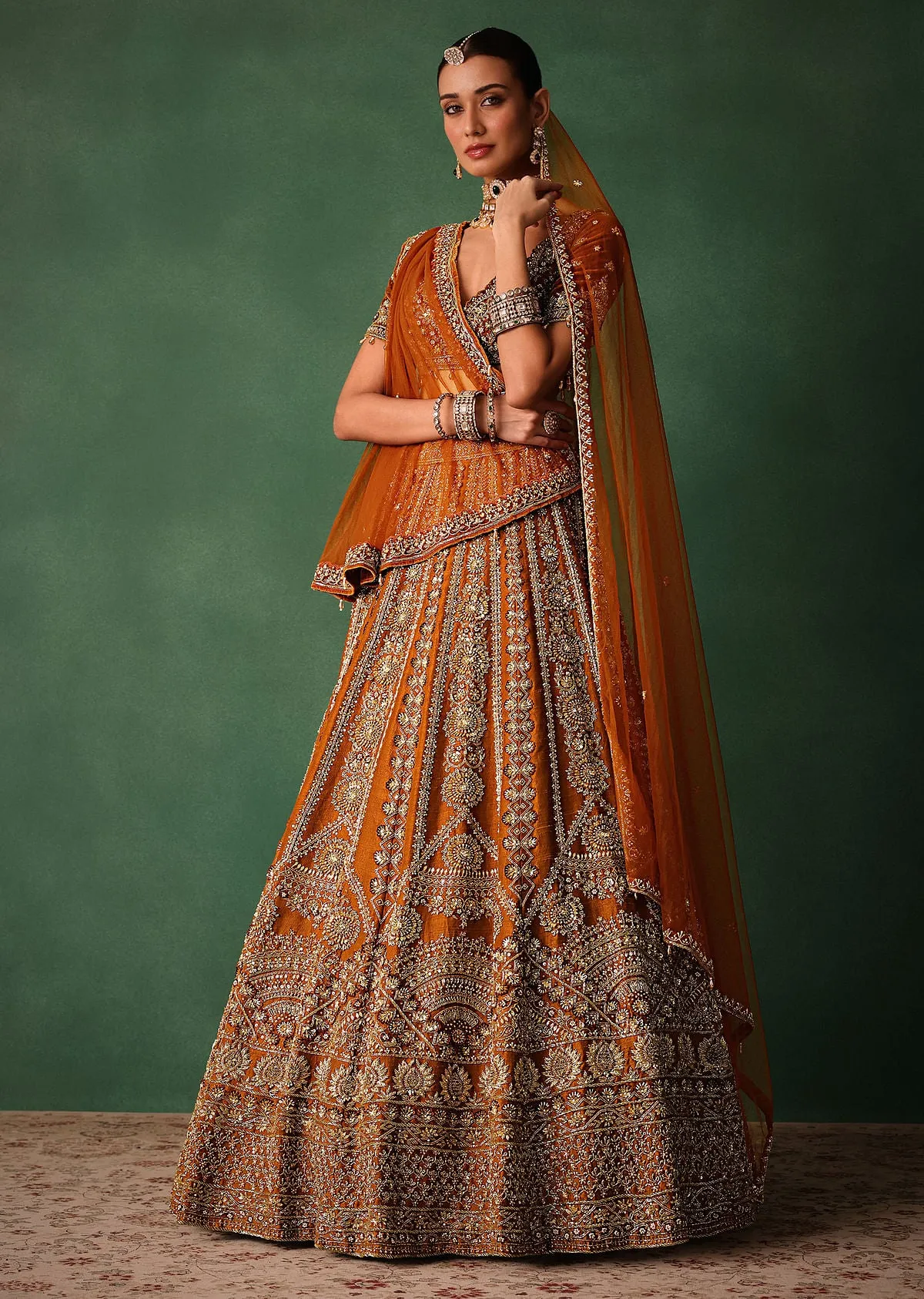 Rust Embroidered Bridal Lehenga With Deep Neckline Blouse And Dupatta
