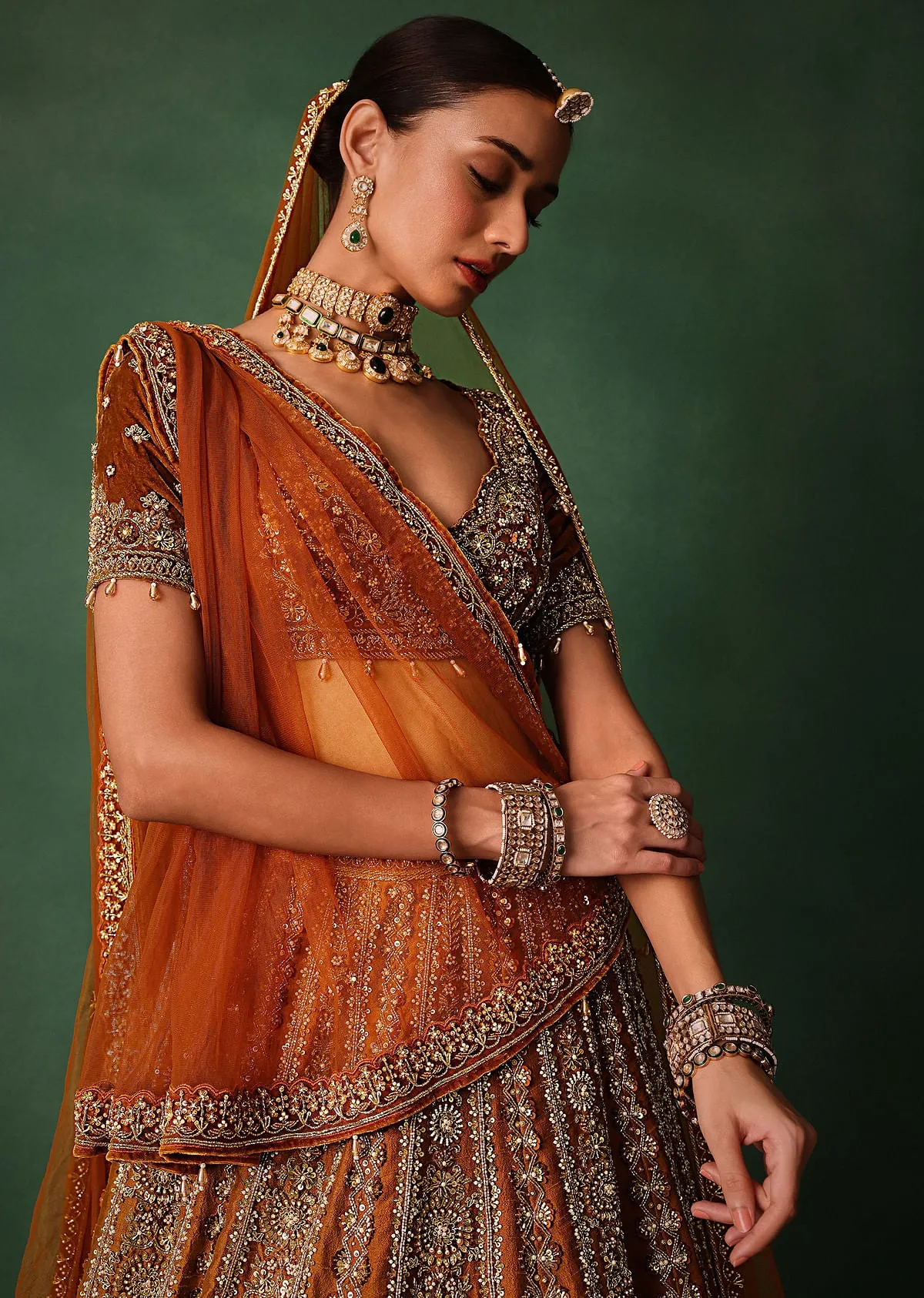 Rust Embroidered Bridal Lehenga With Deep Neckline Blouse And Dupatta