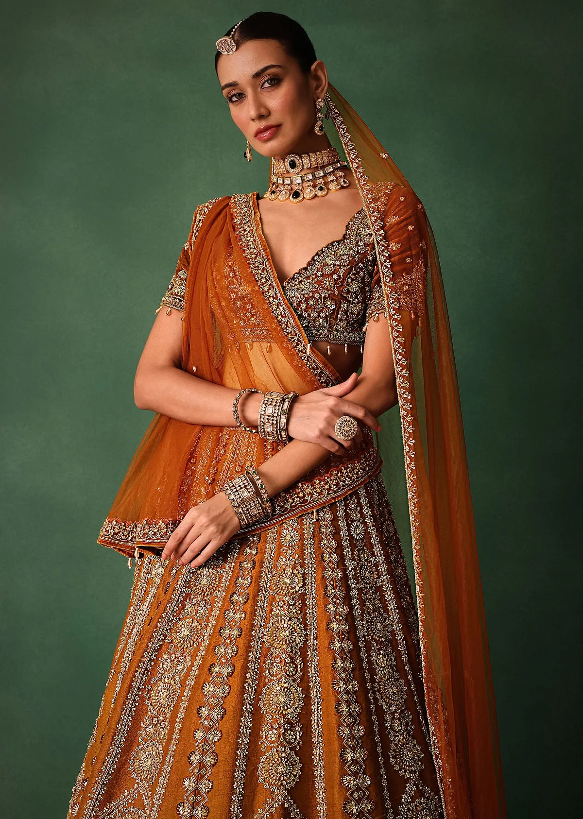 Rust Embroidered Bridal Lehenga With Deep Neckline Blouse And Dupatta