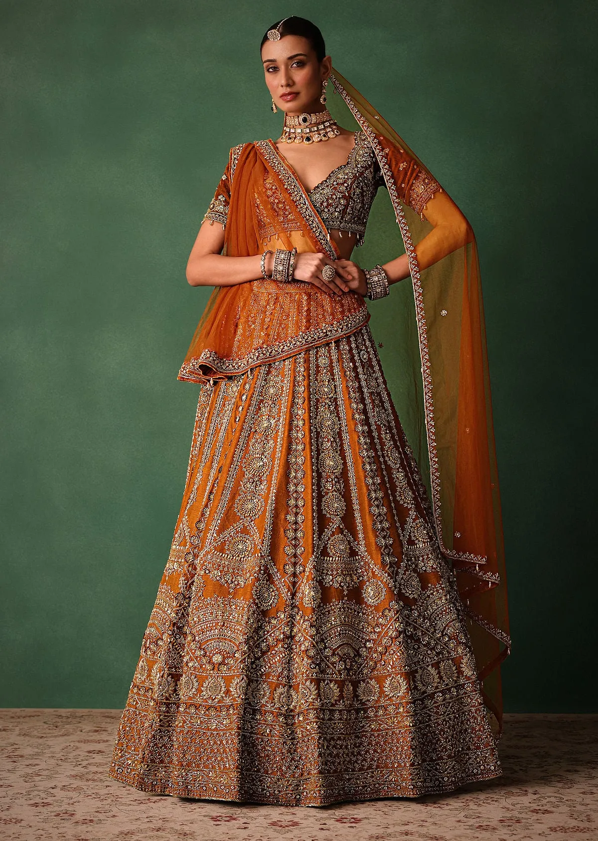 Rust Embroidered Bridal Lehenga With Deep Neckline Blouse And Dupatta