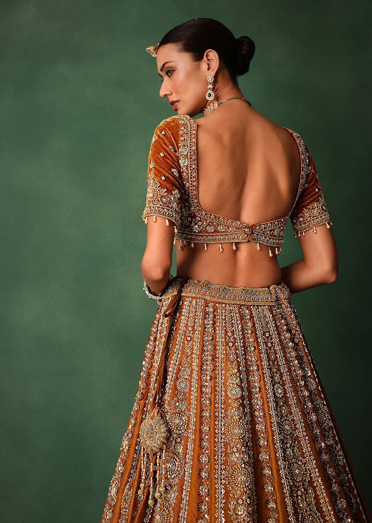 Rust Embroidered Bridal Lehenga With Deep Neckline Blouse And Dupatta